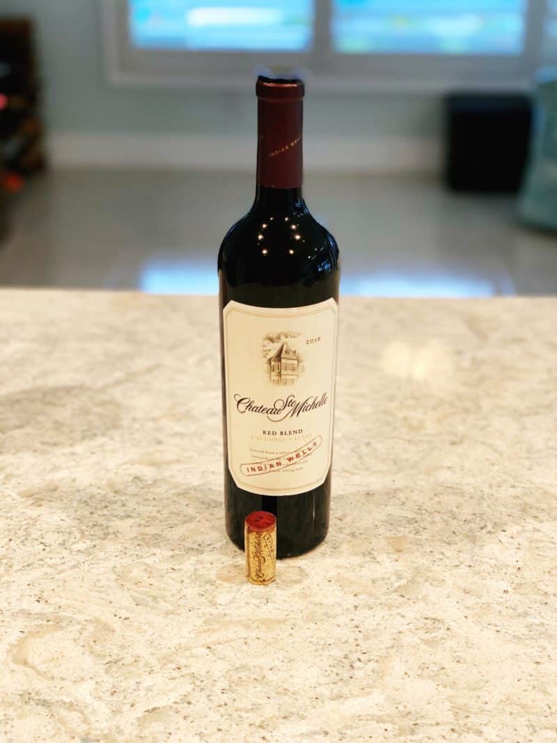 bottle of red wine sitting on countertop