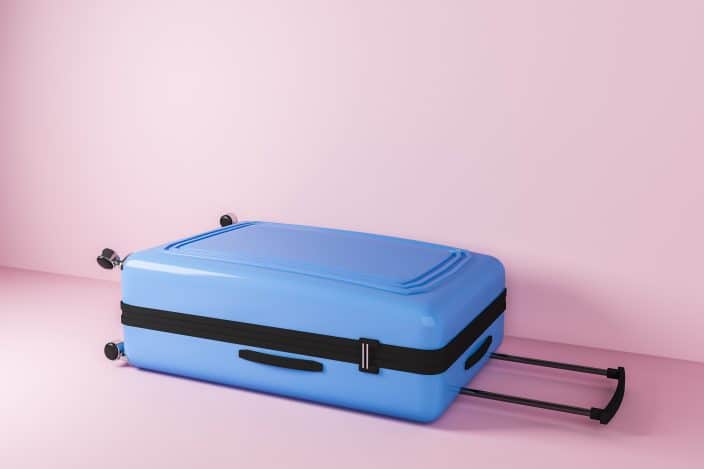 a blue carry-on suitcase