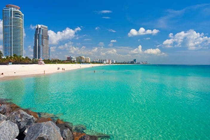 Florida beach with blue water, beach and highrises