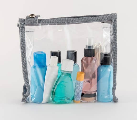 toiletries in a clear pouch for traveling