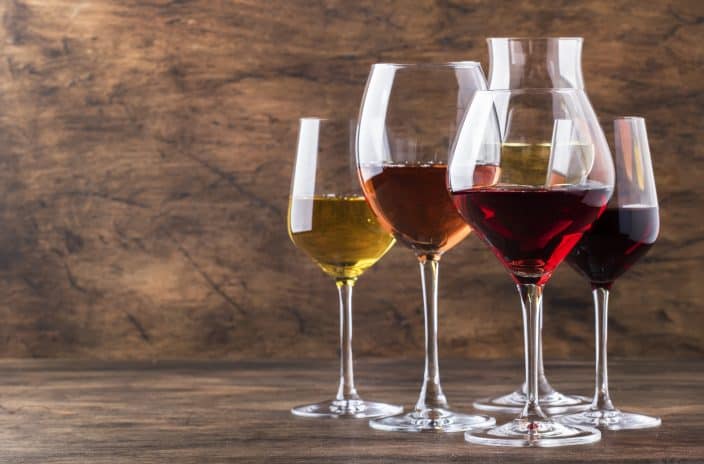 an assortment of wines in wine glasses which you can sample at wineries in Virginia