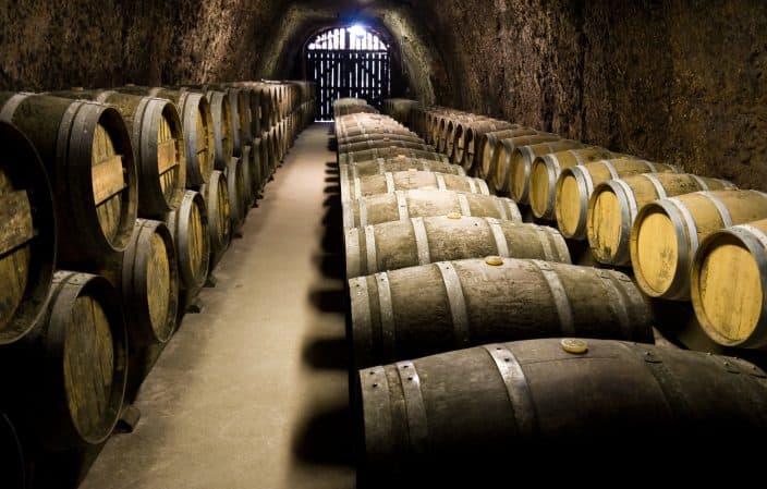 a wine cellar with barrels of wine inside