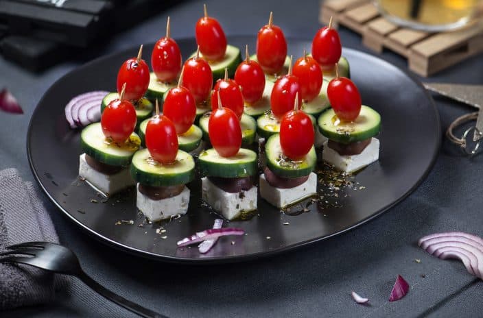salad skewers with feta cheese, tomatoes, olives, and cucumber