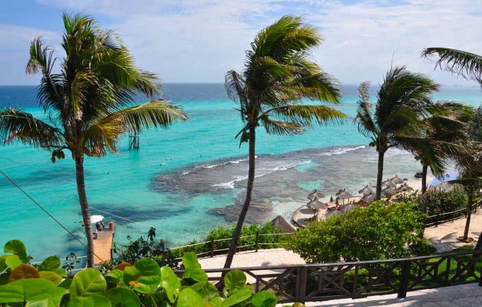 Isla Mujeres with Palm Trees overlooking the turquoise water, one of the best beaches in Mexico