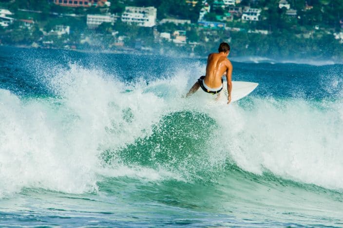 surfing in Puerto Escondido, one of the best beaches in Mexico