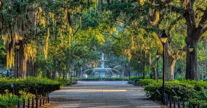 forsyth park in savannah georgia with large trees and a fountain, an example of romantic getaways in georgia