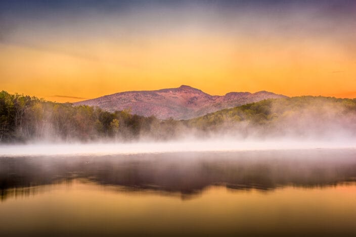fog on the lake with Grandfather Mountain in the background