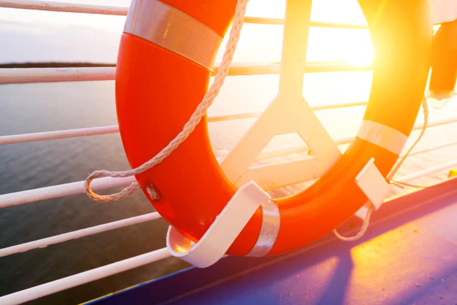 life ring on boat deck with sun streaming in