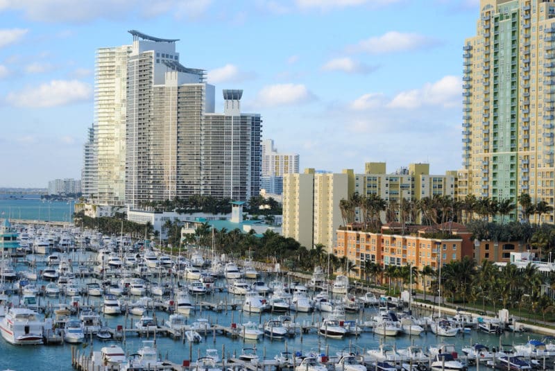 Skyline of the city of Miami, Florida with yachts and boats which you can see during your romantic miami getaway