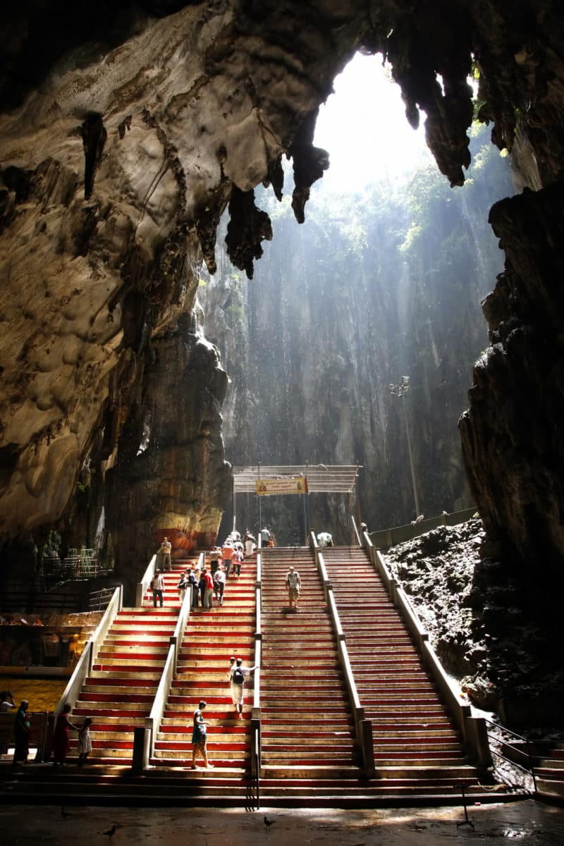 Ancient Batu Caves in Malaysia having a hindu temple inside.