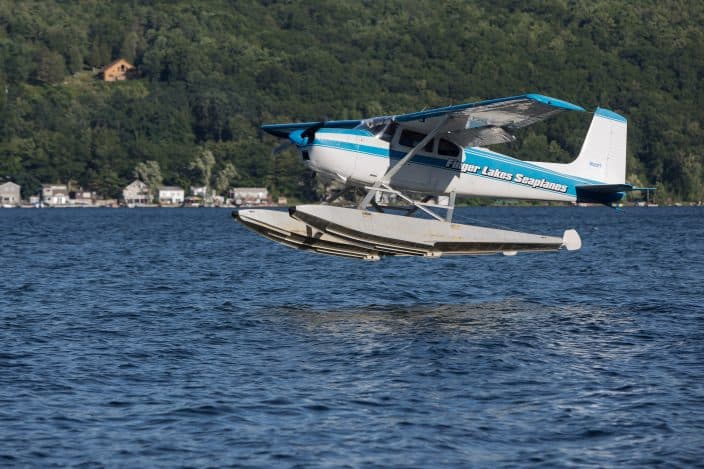 Seaplane taking off from the lake in the Finger Lakes, NY