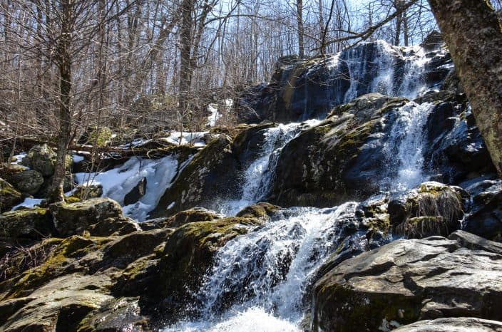 Springtime at Dark Hollow Falls, a waterfall located within Shenandoah National Park in Virginia along Skyline Drive in the Blue Ridge Mountains, an adventure vacation location