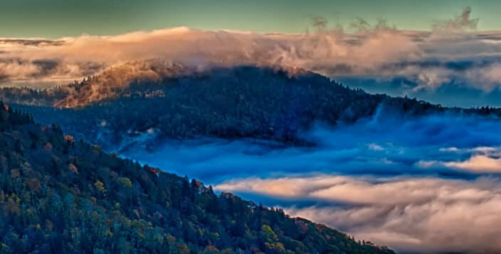 fog laying in the valleys with the mountains above